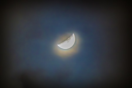 Nightly sky with moon and cloudsの写真素材