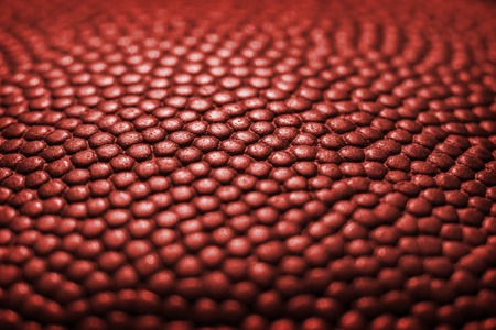 Classic basketball ball detail leather surface texture backgroundの写真素材