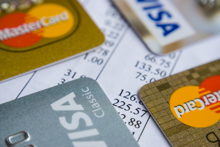 Krasnodar, Russia - May 9, 2017 : Master card and VISA cards on the an invoice for payment.のeditorial素材