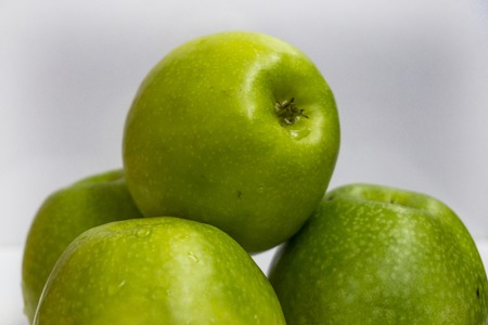 Fresh green apple fruits on white backgroundの写真素材