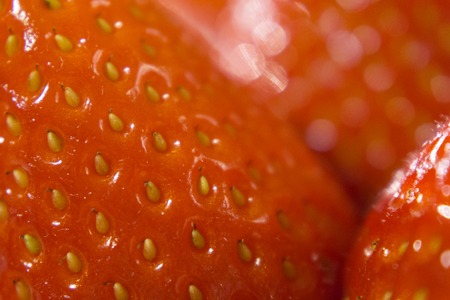 Close-up detail of a fresh red strawberryの写真素材