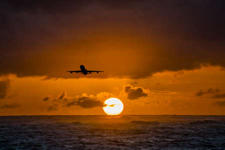 Aircraft flying over amazing tropical ocean at sunrise. Dominican Republic travel destinations.の写真素材