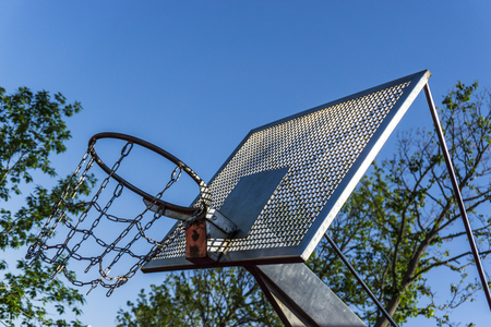 Basketball basket with chains on streetball courtの写真素材