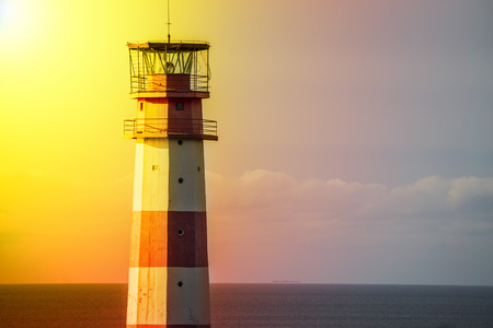 Lighthouse light spining around. Red and white lighthouse.の写真素材