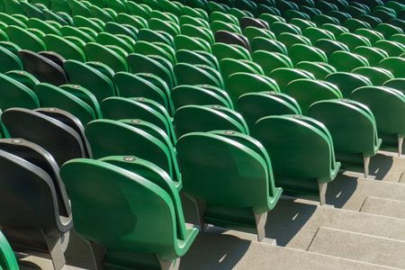 Empty plastic seats in a stadium. Matches to be played without fans