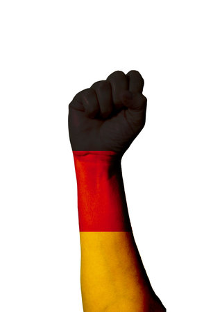 Flag of Germany painted on human fist. Strength, power, concept of conflict. Raised fist.の写真素材