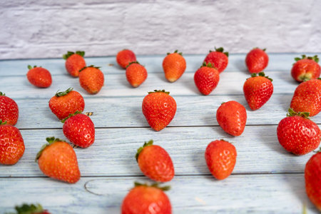 Pattern of strawberries in wooden and rustic background