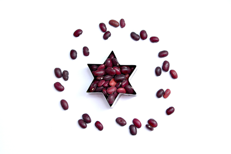 Red beans in a star shape Red beans isolate on a white background. Dried Red beans on a white background. Red beans for a healthy dietの写真素材