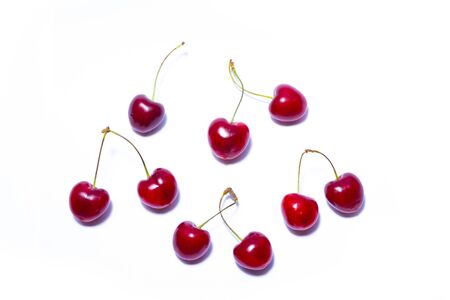 Cherry on a white background. Ripe cherry isolated. Sherry berry fruit isolated on white background. Sweet cherry. Red cherry. Cherry on white. Cherry isolated.の写真素材