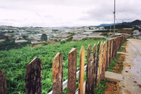 Old wooden fence and road perspective view in village retro style