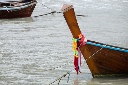 Colorful decorations on the bows of longtail boats,
Long tail boat decorated with colorful fabric. At the coast of tourism,Thailandの写真素材