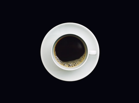 Coffee cup top view isolated on black background.の写真素材