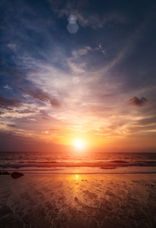 Nature in twilight period, Sunrise or Sunset over the sea with beach. Sea view from tropical beach with purple and orange sky. Vintage retro sea scape.の写真素材