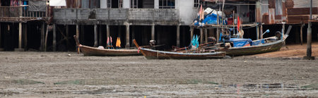 A small fishing boat at a fishing village,long tail boat at Thailandの写真素材