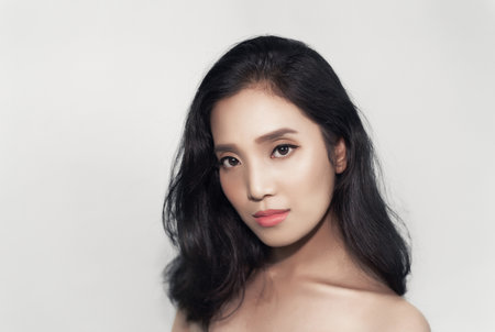 Girl's face Show facial organs and skin on a white background under the concept of beauty, cosmetic products and women.の写真素材