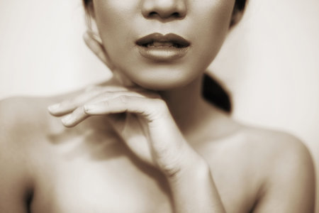 beautiful woman's face From nose to chest Showing bright lips And clean, healthy natural skin cleared, under the concept of beauty And skin care in a duo tone colorの写真素材