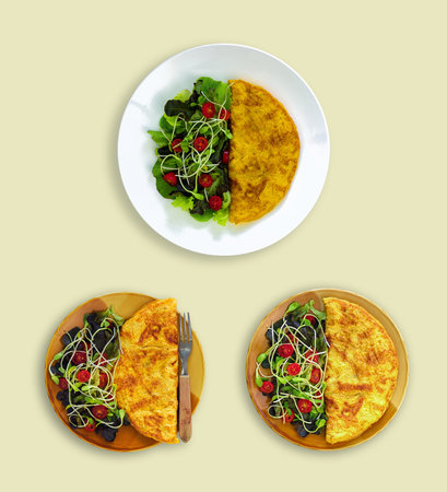 set of home made omelet with a vegetable salad under clean food concept in a plate that isolated on...