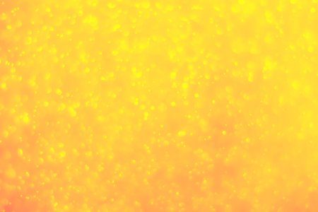 Bokeh background and bubbles reflecting yellow goldの写真素材