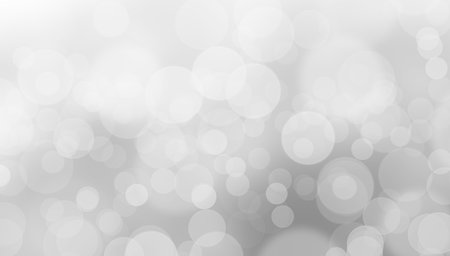 black and white bokeh background with bright light from the top right cornerの写真素材