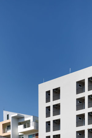 White buildings against the sky and clound.