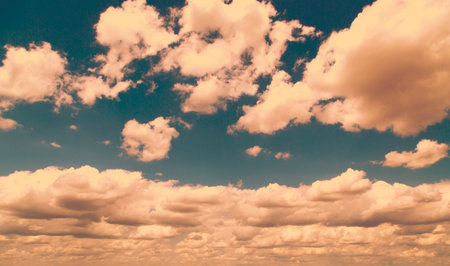 White fluffy clouds over blue sky