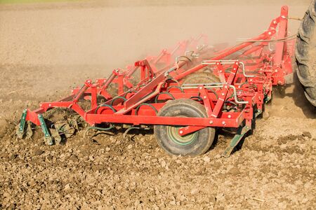 Close up shot of seedbed cultivator machine at workの写真素材
