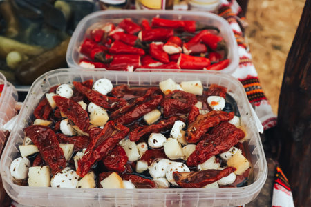 Marinated vegetables and cheeses in sauce. Snacks to meat.. Street food. Homemade sausage. Pickles and salads. Festival of street food and meat.の写真素材