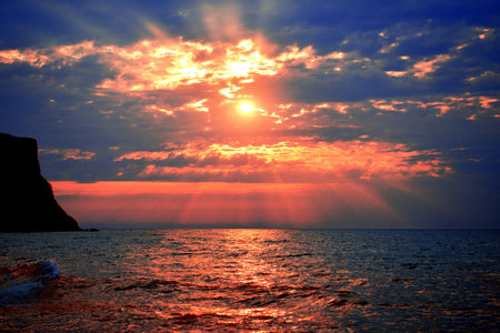 Stunning sea sunset on a background of mountainsの写真素材