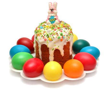 Easter on a plate decorated with eggs isolated on white background