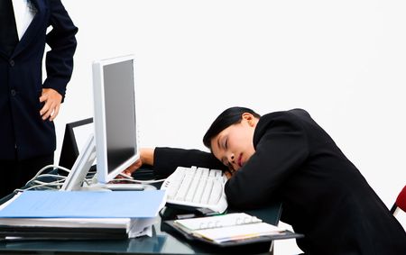 The boss watching the secretary sleeping at working hour with angry pose.の写真素材