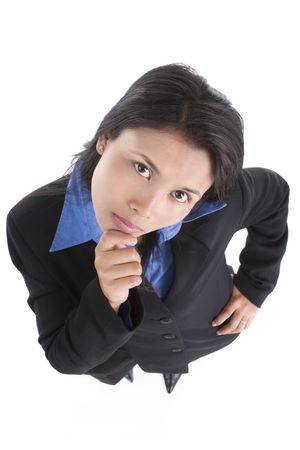 A young business woman contemplating the camera. Shot taken from above with wide angle lens and cause the barrel distortion, which the head proportion gets larger.の写真素材