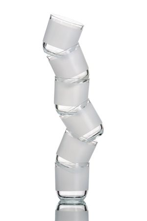 A pile of half dozen glasses arranged like that, shoot against very bright white screen.の写真素材