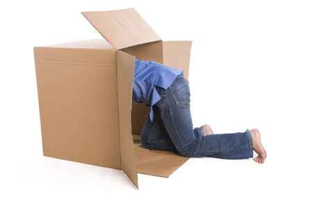 A woman is crawling inside the box, only bottom half of her body showed here.の写真素材