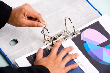 Binding the documents in a binder. Focused mainly on the binder mechanism.の写真素材