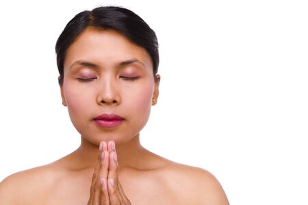 Young Balinese woman is on meditation with lot of copy space on the right.Lの写真素材