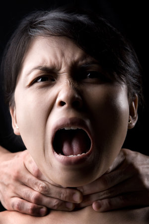 Young Asian woman being choked.
