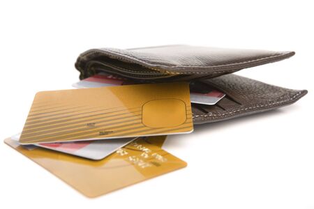 Credit cards scattered around the wallet, isolated on whiteの写真素材