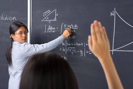 A student asking to the teacher about mathematicsの写真素材