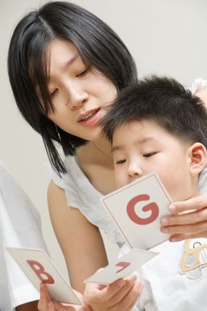 Asian mother tutoring her son for early educationの写真素材