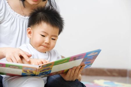 Asian mother tutoring her son for early educationの写真素材