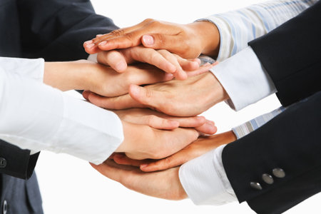 People put their hand on top of each other