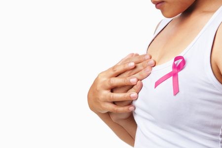 Woman hold another hand to embrace her breast. Concept to support breast cancer causeの写真素材