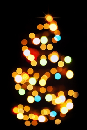 Christmas tree light pattern blur light on dark backgroundの写真素材