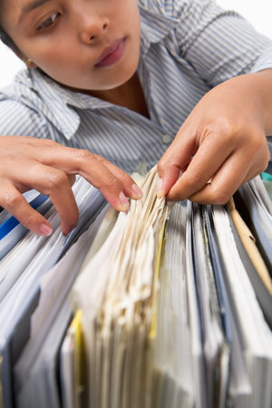 An Asian lady looking for document betweenの写真素材
