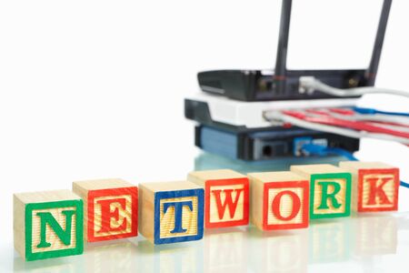 Word 'Network' in front of modem, router and witch for computer networkingの写真素材