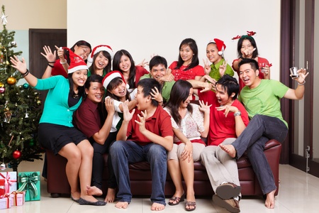 Christmas group photo shot of Asian young peopleの写真素材