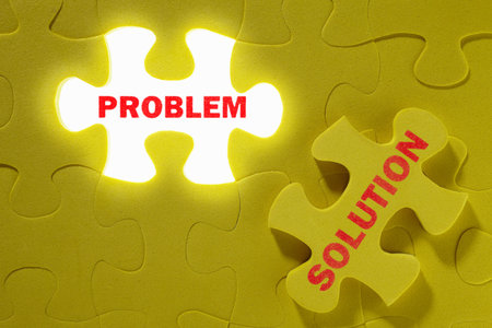 Conceptual shot with missing piece of yellow jigzaw puzzle