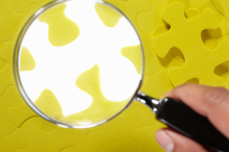 Conceptual shot with missing piece of yellow jigzaw puzzle