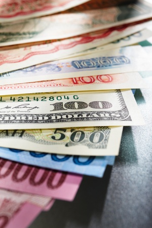 Money from different countries, arranged overlap of each otherの写真素材