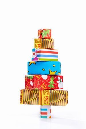 Chrsitmas tree shape made from several sizes  of wrapped cardboard boxes on whiteの写真素材